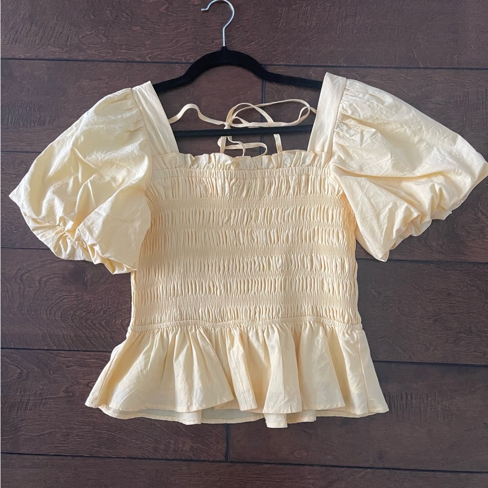 Shirred, puff sleeve peplum top.